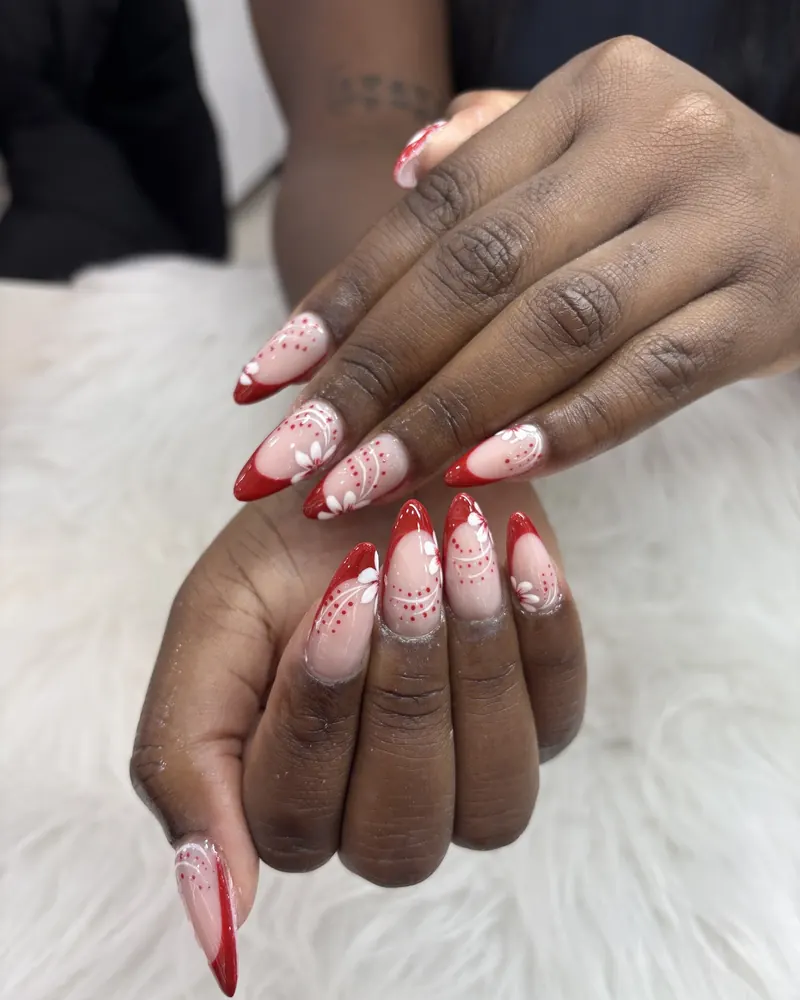 Red French tip stiletto nails with lace art at Chillux Nails, Orpington
